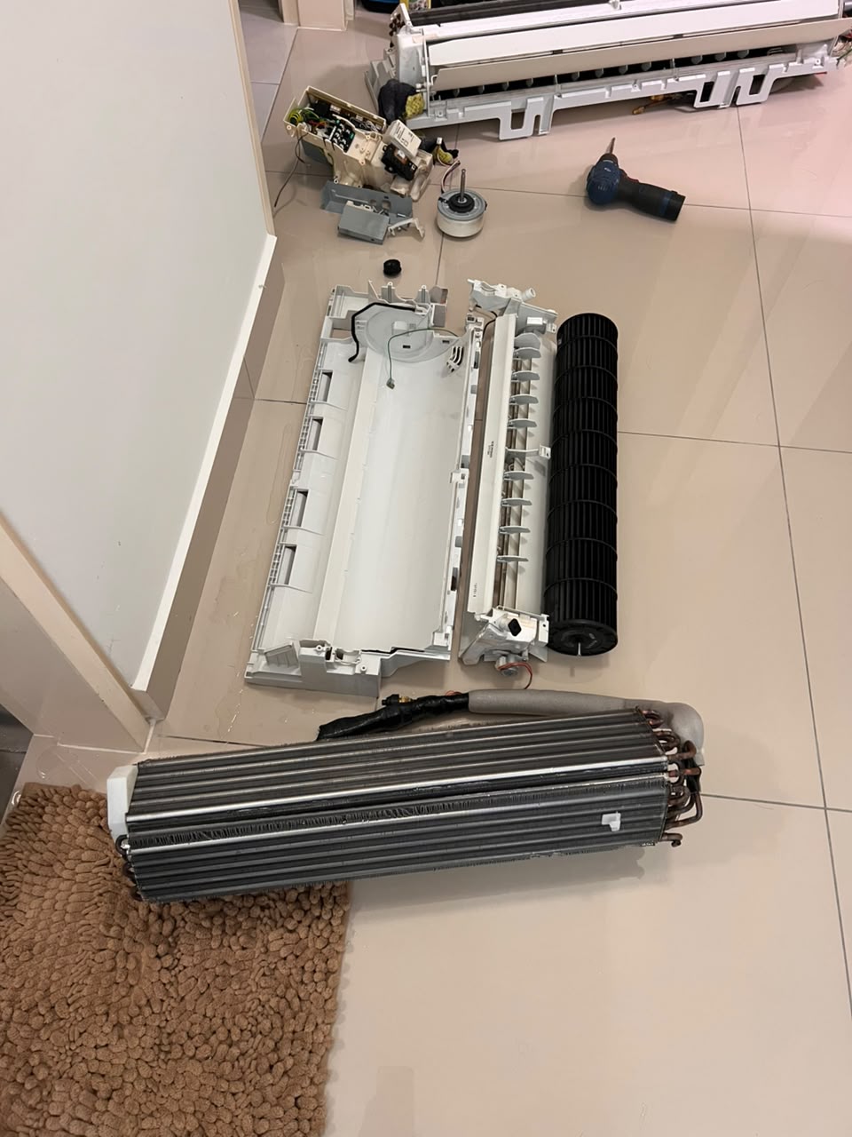 Aircond parts washed clean after a chemical overhaul